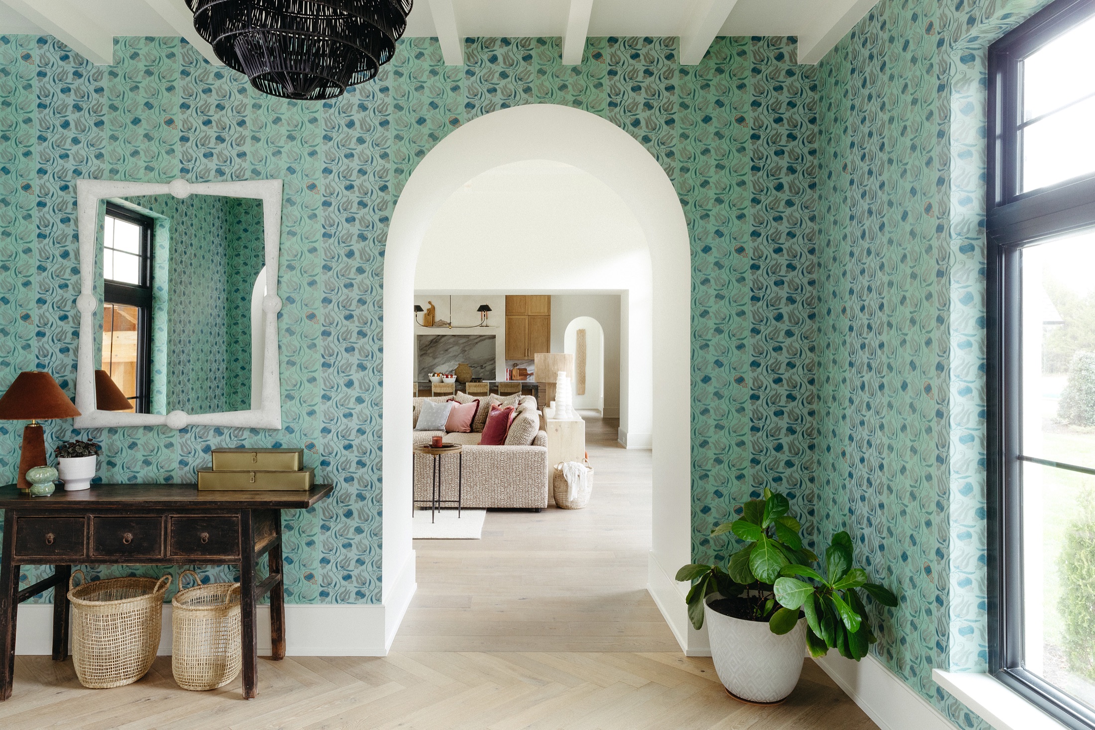 A patterned entry opening into a Bowery European white oak interior