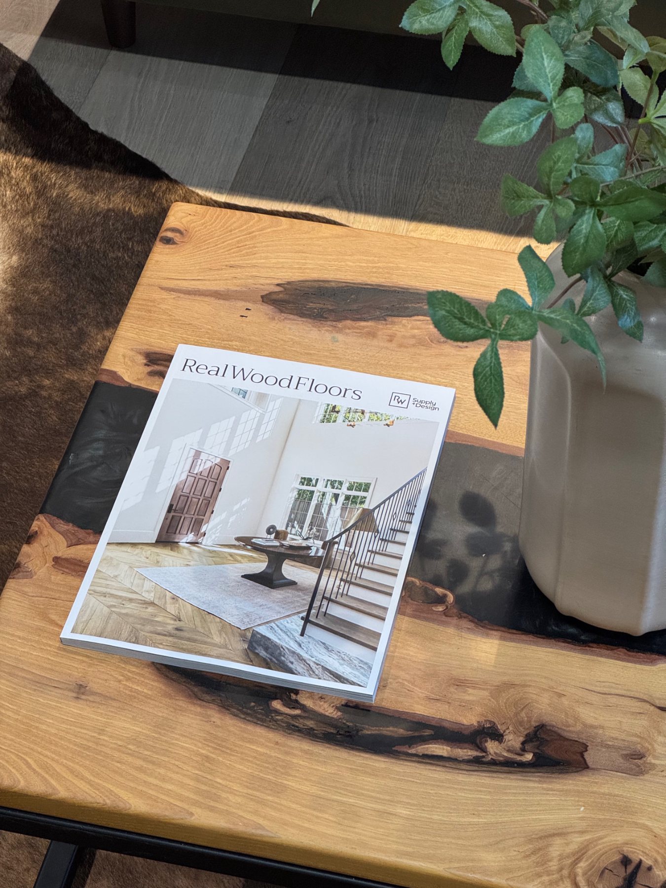 Real Wood Floors Lookbook displayed on a natural wood table