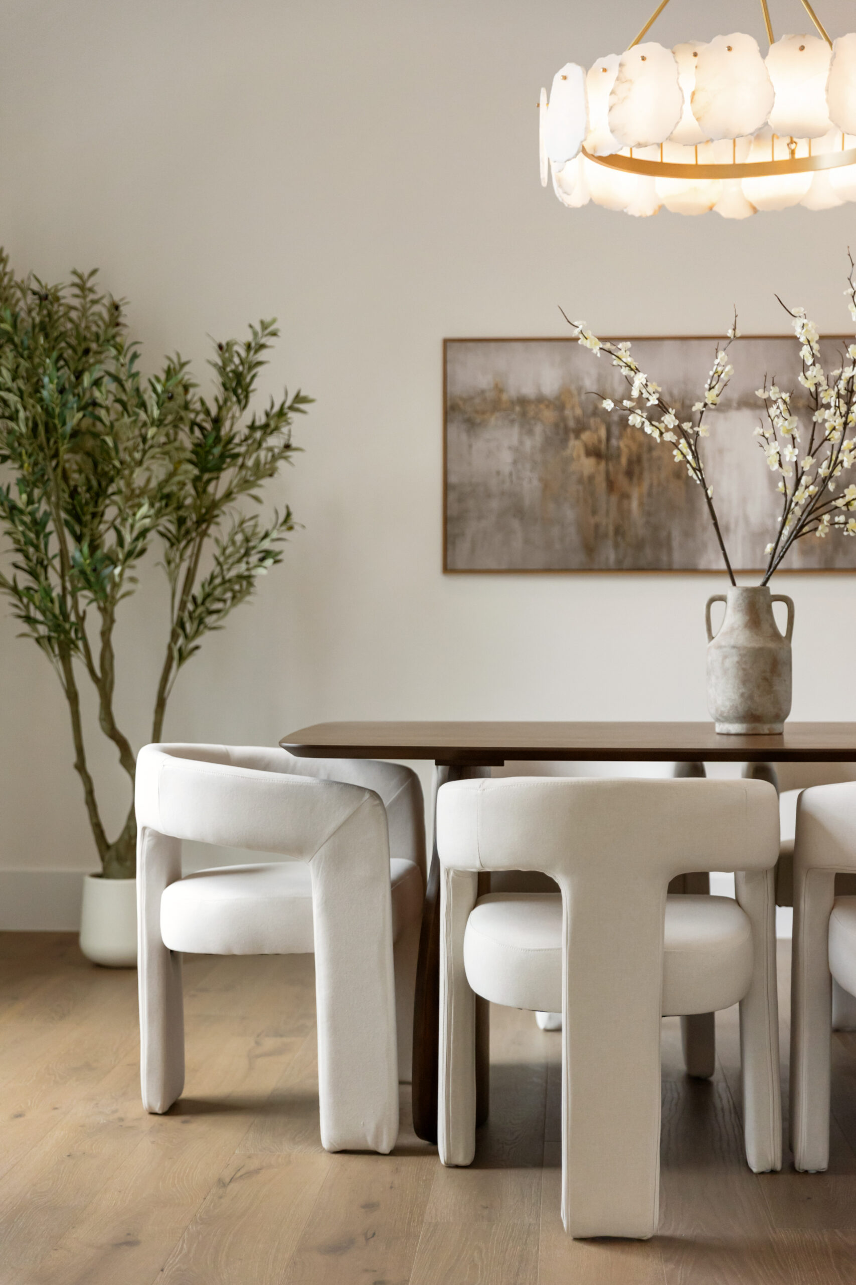 Wide-plank flooring beneath a contemporary dining space