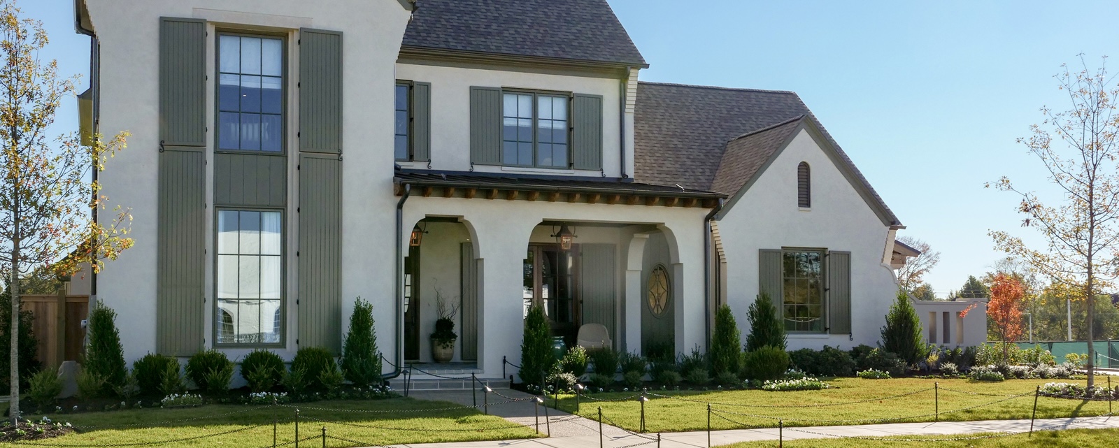 Award-winning Hidden Creek show home in Collierville, Tennessee, featuring French-inspired architecture and elegant landscaping.