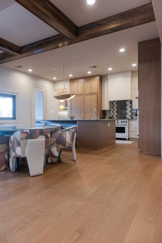 Eller Construction and Lovelace Studios combine European white oak floors, expressive dining chairs, and contemporary architectural finishes in this Memphis home.