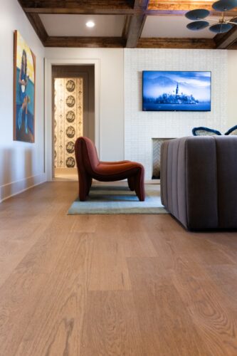 Lovelace Studios layers moody colors, plush textures, and expressive furnishings over European white oak floors in this Vesta Parade home.