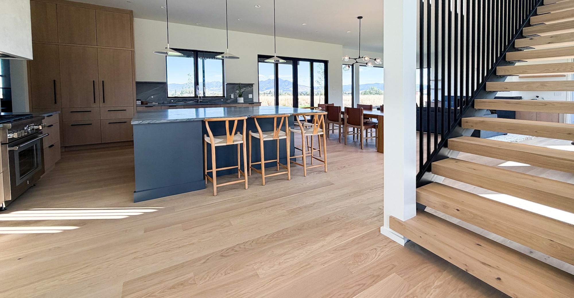 Rennes – Country 9 Hero Wide plank European white oak flooring by Real Wood Floors installed in a Bozeman kitchen.